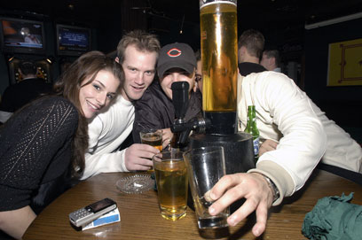 The 'Table Tapper,' a glass that holds more than six beers, gets a workout at The Lion Head Pub, 2251 N. Lincoln Ave.