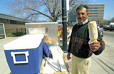A street vendor selling corn