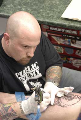 A tattoo artist at Chicago Tattoo and Piercing Company