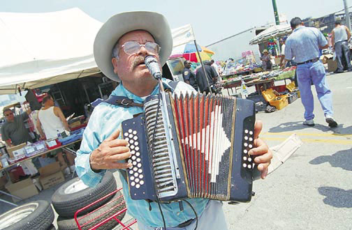 Playing the Mexican accordion at the Maxwell Street Market