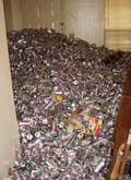 70,000 beer cans probably means no return of the security deposit